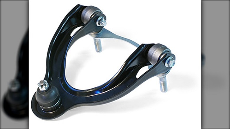 A control arm painted black, sitting against a white background.