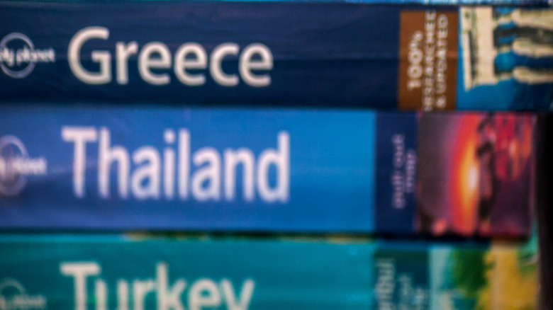 A stack of Lonely Planet Guidebooks.