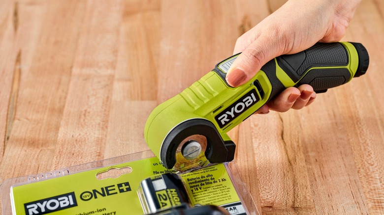 The Ryobi usb lithium power cutter kit used to cut open a Ryobi One+ box