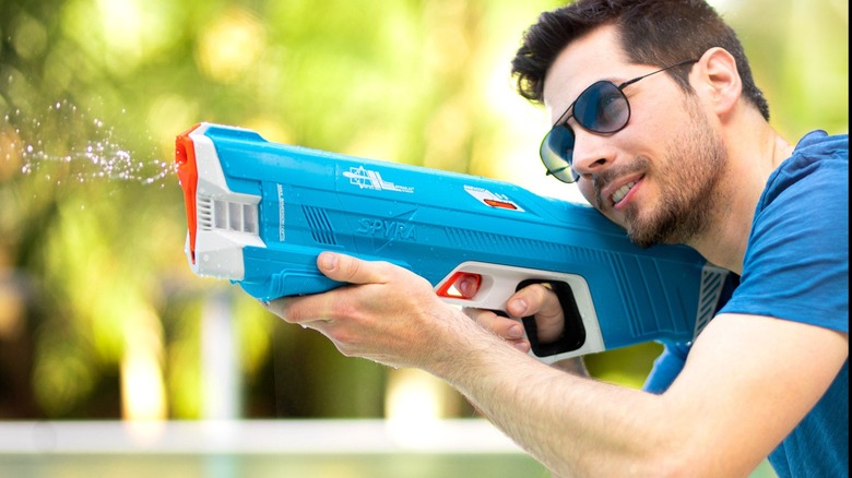 Spyrathree water gun held by a man