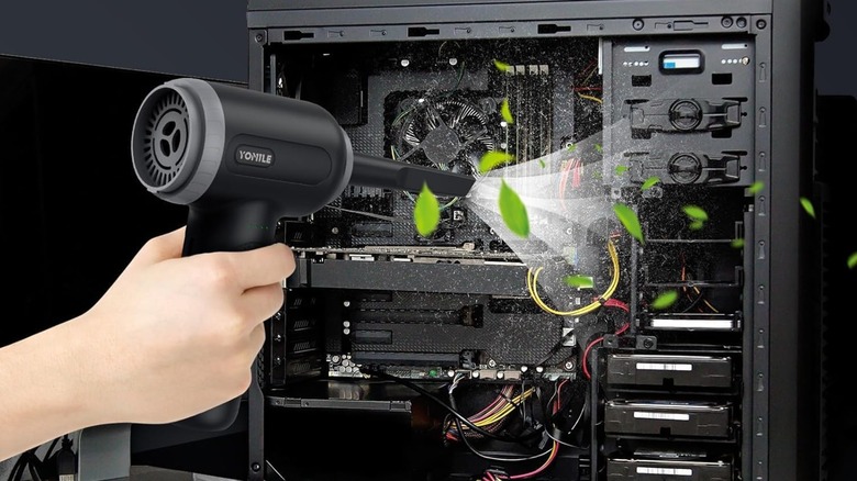 The Yomile air vacuum duster used on a computer