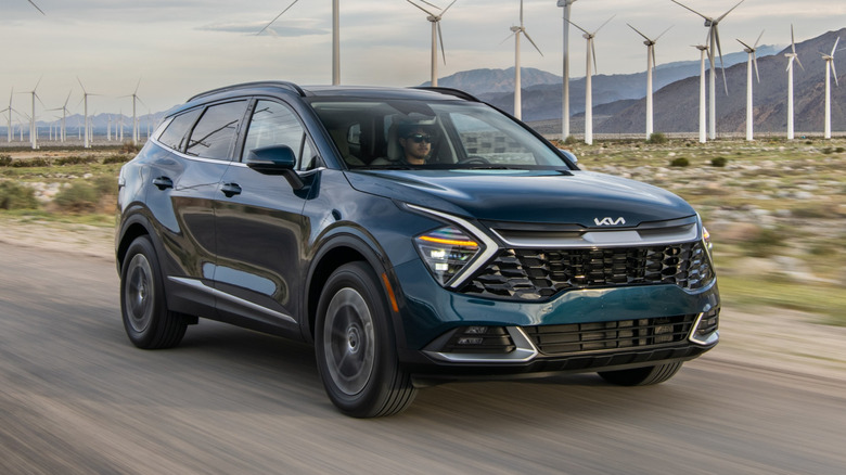 2024 Kia Sportage Hybrid near a wind farm