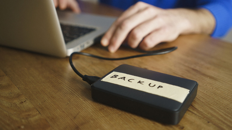 A backup hard disk connected to a laptop