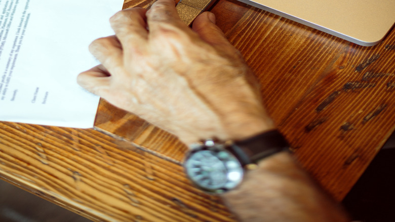 A person plugging a USB device into a laptop