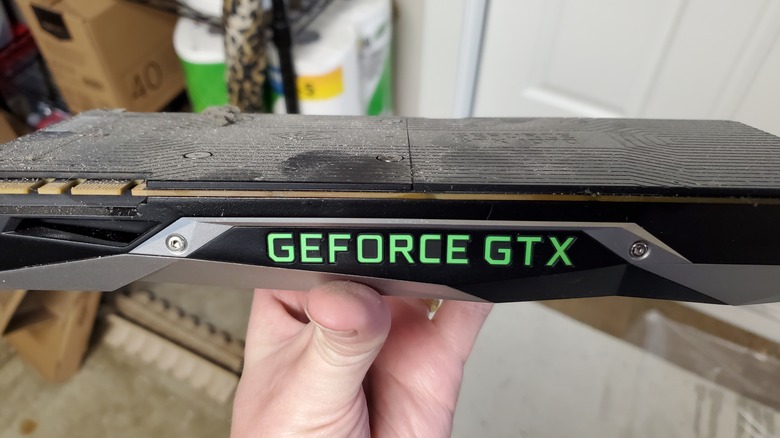 An NVIDIA GeForce GTX GPU held in the hand