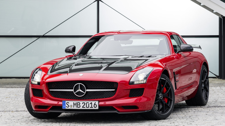 Mercedes-Benz SLS AMG Gullwing parked in front of a garage door