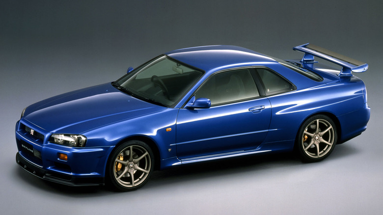 Blue R34 Nissan Skyline with a gray background