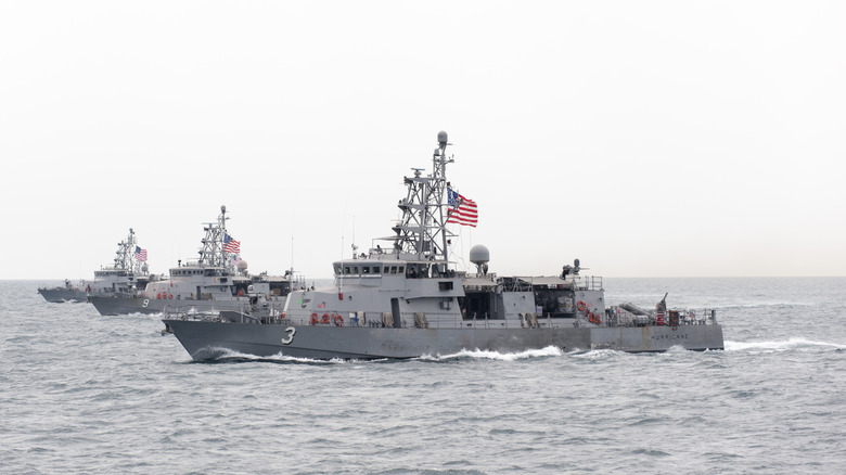 Three Cyclone-class patrol ships seen from port side in formation in the Persian Gulf