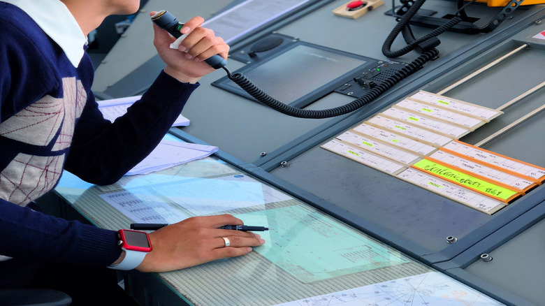 Air traffic controller on radio