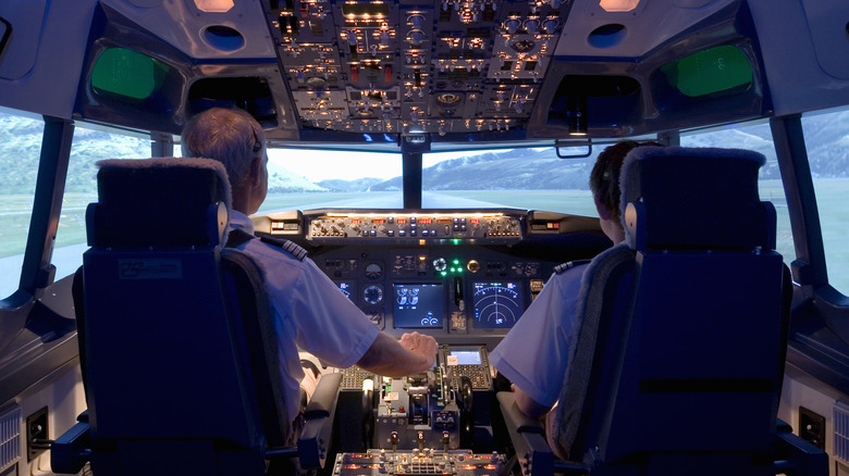 Pilots seated in plane cockpit