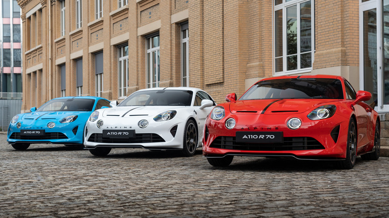 Three Alpine A110 sports cars