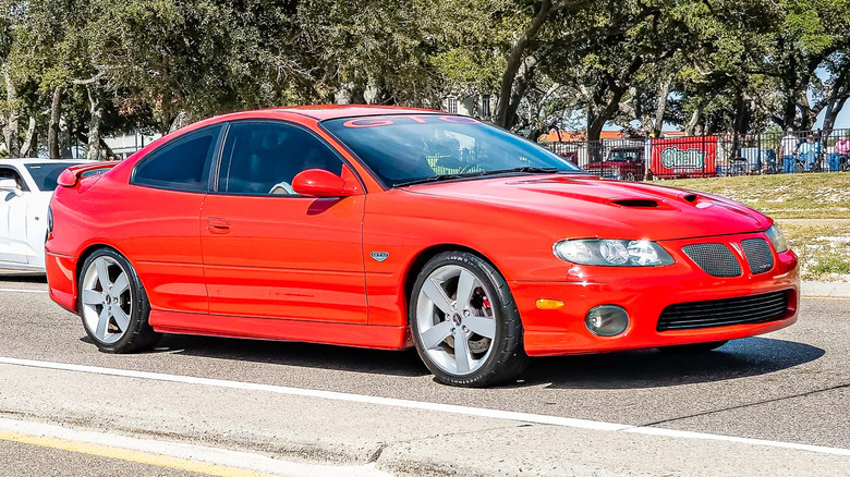 Pontiac GTO driving into a car show