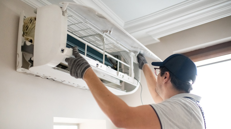 Person repairing air conditioner