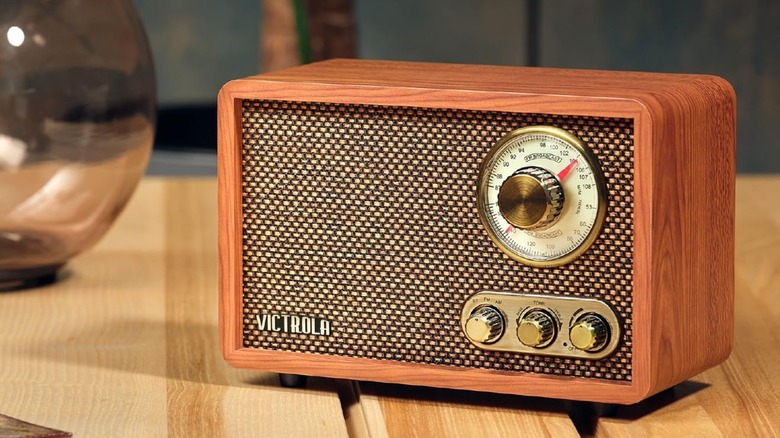 The Victrola Willow Bluetooth speaker and radio on a wooden desk.