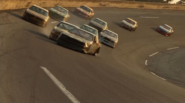 A NASCAR stock car taking a nudge before turning sideways in a still from the 1990 film, "Days of Thunder" starring Tom Cruise.
