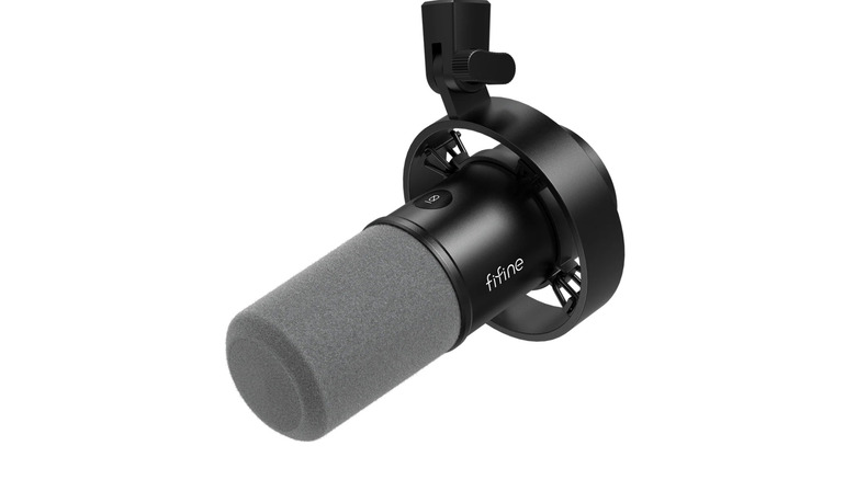 Black microphone over a white background