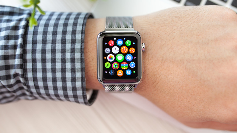 The Apple Watch smartwatch and a 3D printer bioprinting organic material.