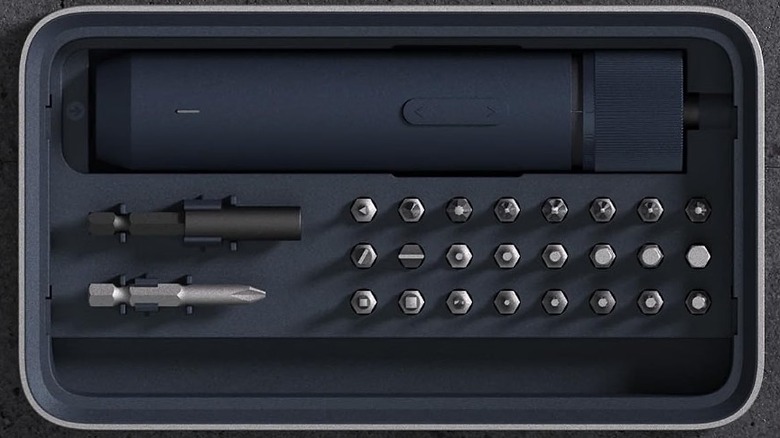 Overhead view of Hoto electric screwdriver kit with bits on on a table