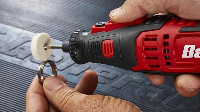 Close-up of person using a Bauer rotary tool to polish a ring
