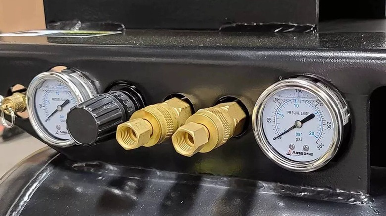 Close up of air compressor, generator, and welder