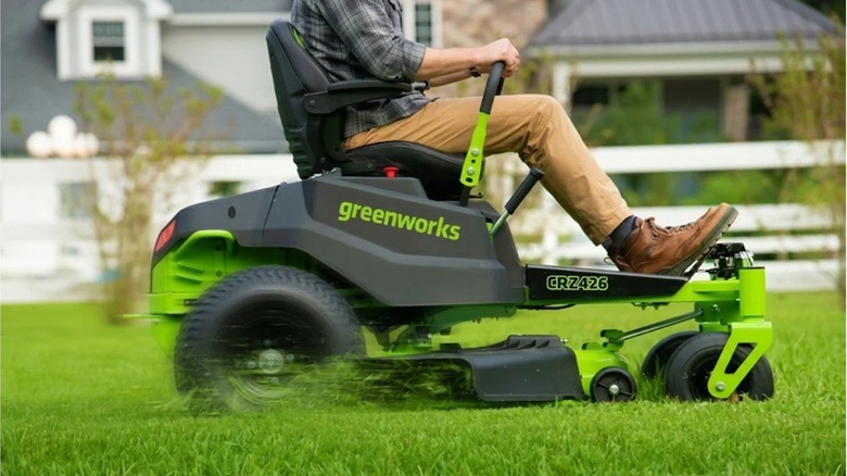 Person riding Greenworks riding mower