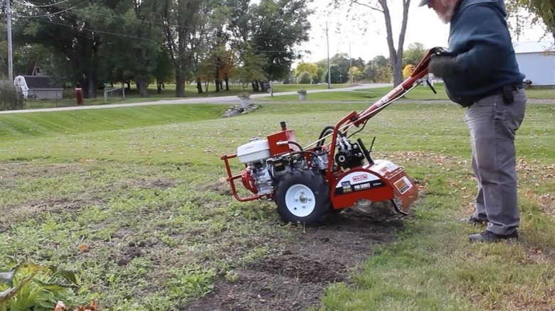 Person using Maxim rear tine tiller
