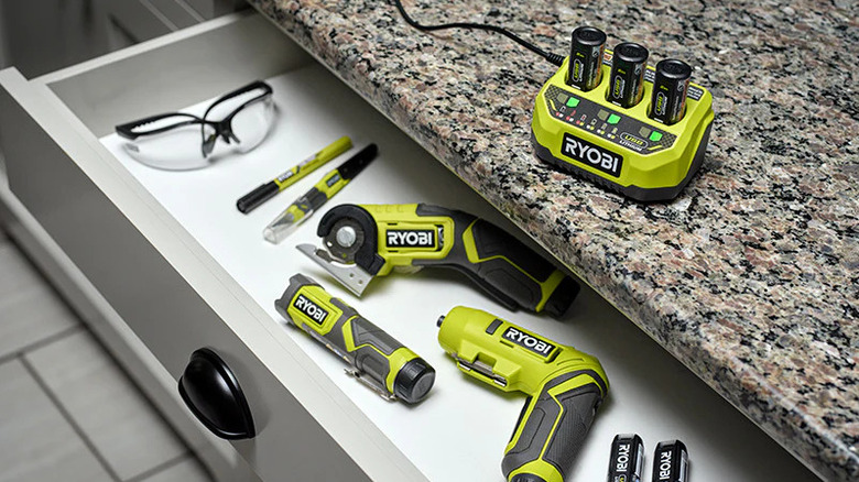 A selection of Ryobi tools including the USB Lithium 3-Port Charger