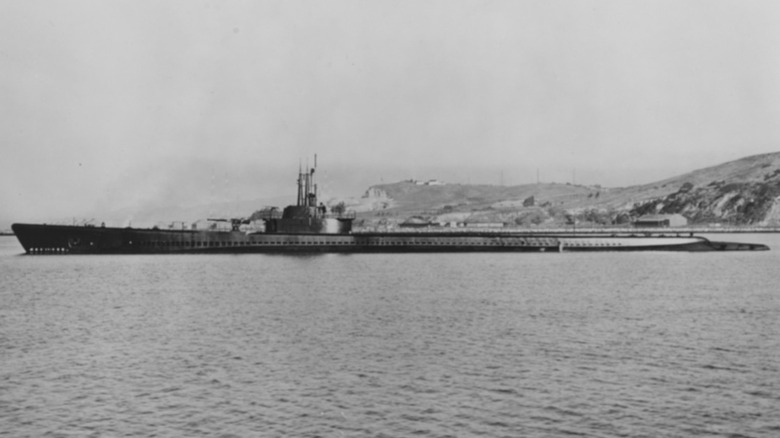 Black & white photo of USS Tang surfaced