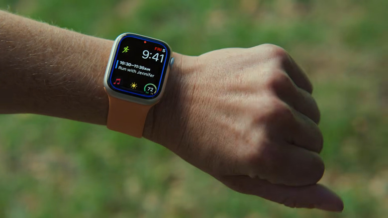 A person using the assistive touch features to control their watch