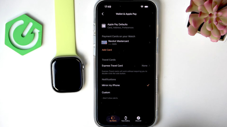 Apple Pay settings on an iPhone next to an Apple Watch
