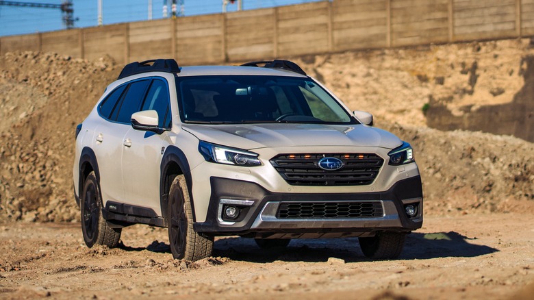 Subaru Outback parked on dirt