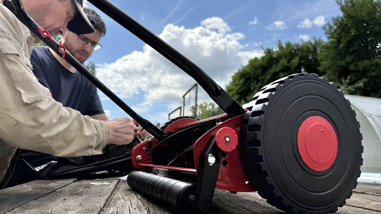 a reel mower on a table