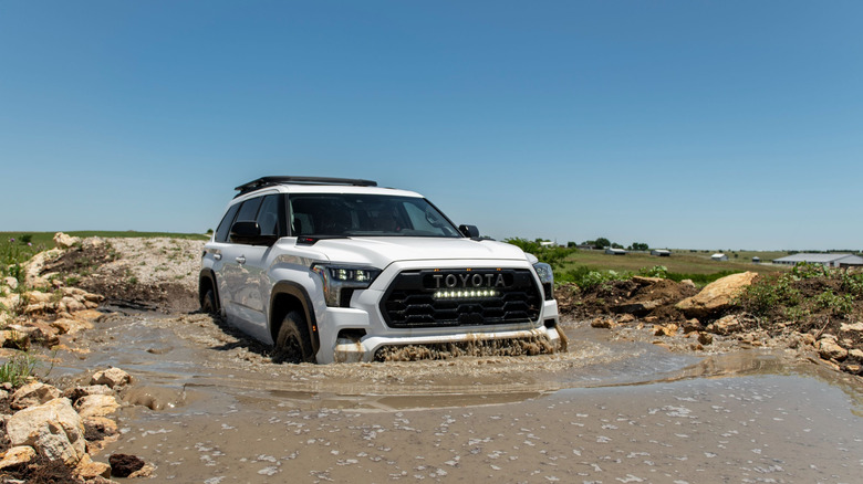 2025 Toyota Sequoia TRD Pro crossing through deep and muddy water