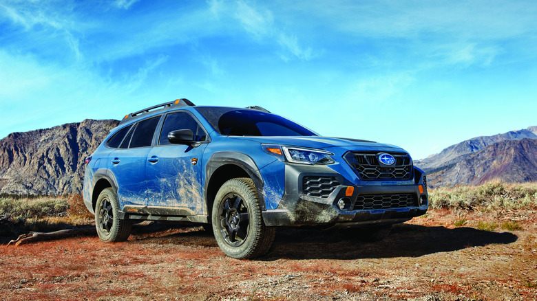 2025 Subaru Outback Wilderness on dirt road front 3/4 view