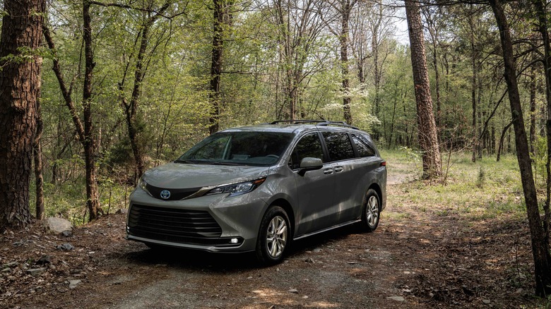 2025 Toyota Sienna Woodland parked in the forest front 3/4 view