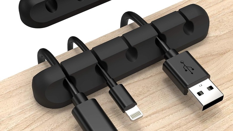 A cable organizer on a desk