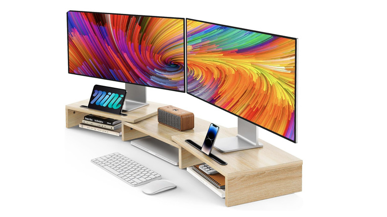 Monitor stands with monitors over a white background