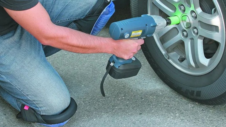 tackling wheel repair while wearing knee pads