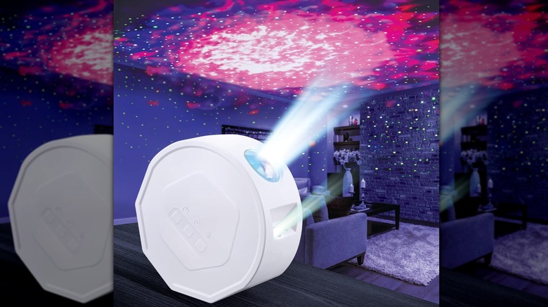 White projector showing starlight and galaxy color on the ceiling