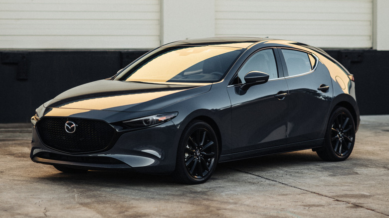 Mazda 3 Turbo by a warehouse