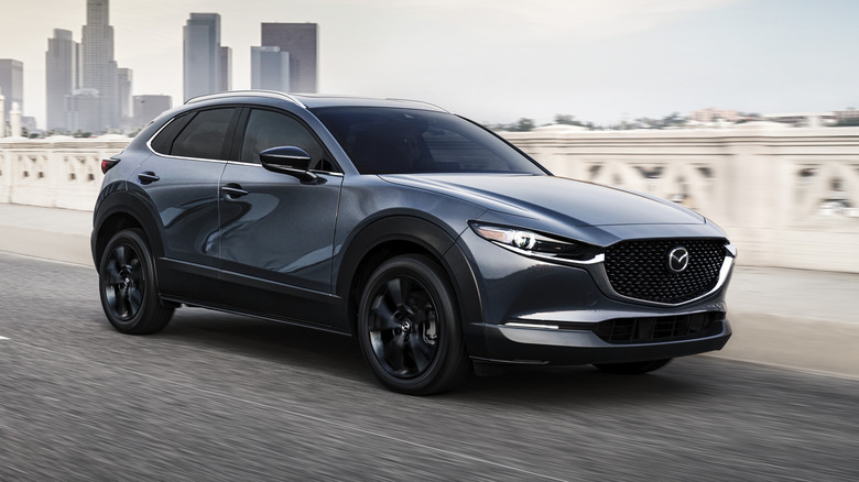 2021 Mazda CX-30 Turbo traveling at speed on an urban road