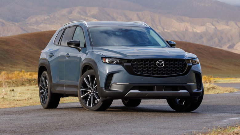 2024 Mazda CX-50 Turbo with mountains in the background