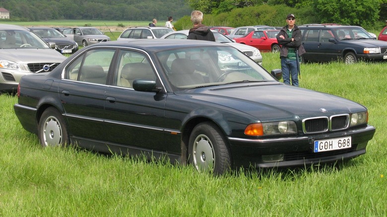 BMW 730i (E38) parked in a field