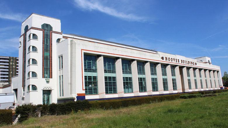An exterior view of the historic Hoover Building featuring a white facade.