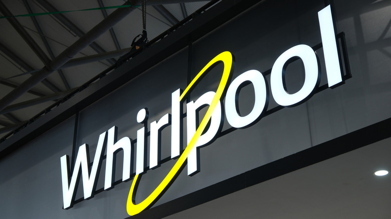 A retail store sign displaying the Whirlpool brand name.
