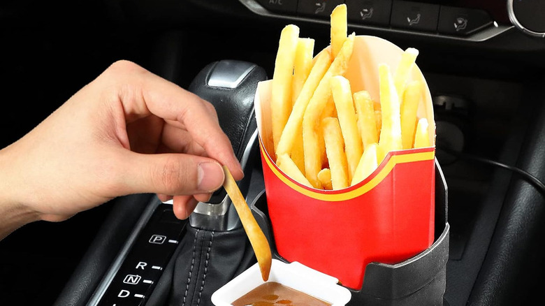 French fries stored in a fries holder inside a car