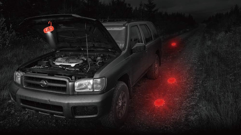 An LED flare light hung on the bonnet of a car