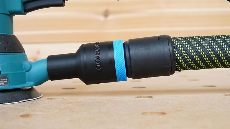 A close-up of the ToolCurve hose adapter for Makita sanders