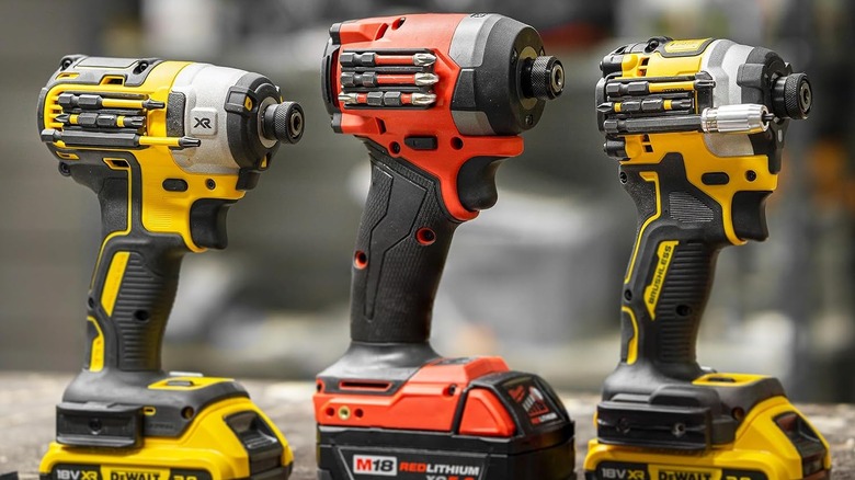 A trio of drills with the magnetic bit holder attached to the side