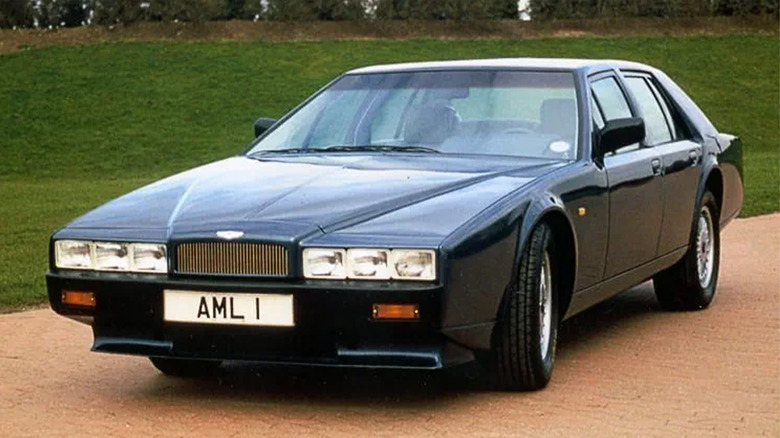 An Aston Martin Lagonda parked on a brick driveway